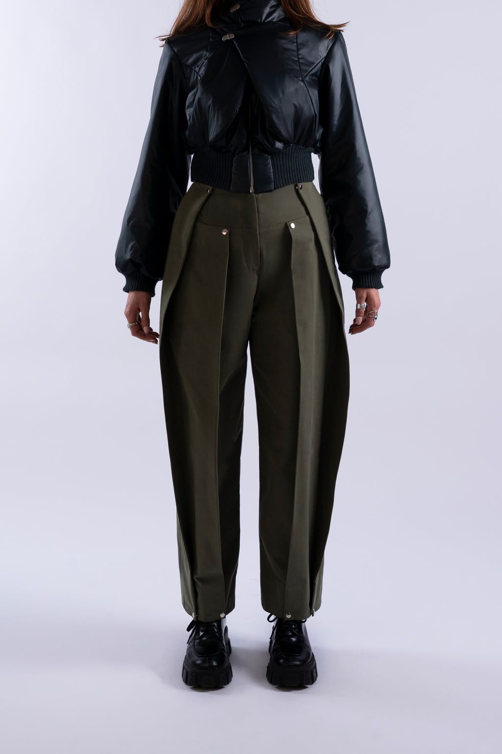 Front view of Stadion Double Pleat Trouser in fatigue green showing dual pleats and silver hardware.