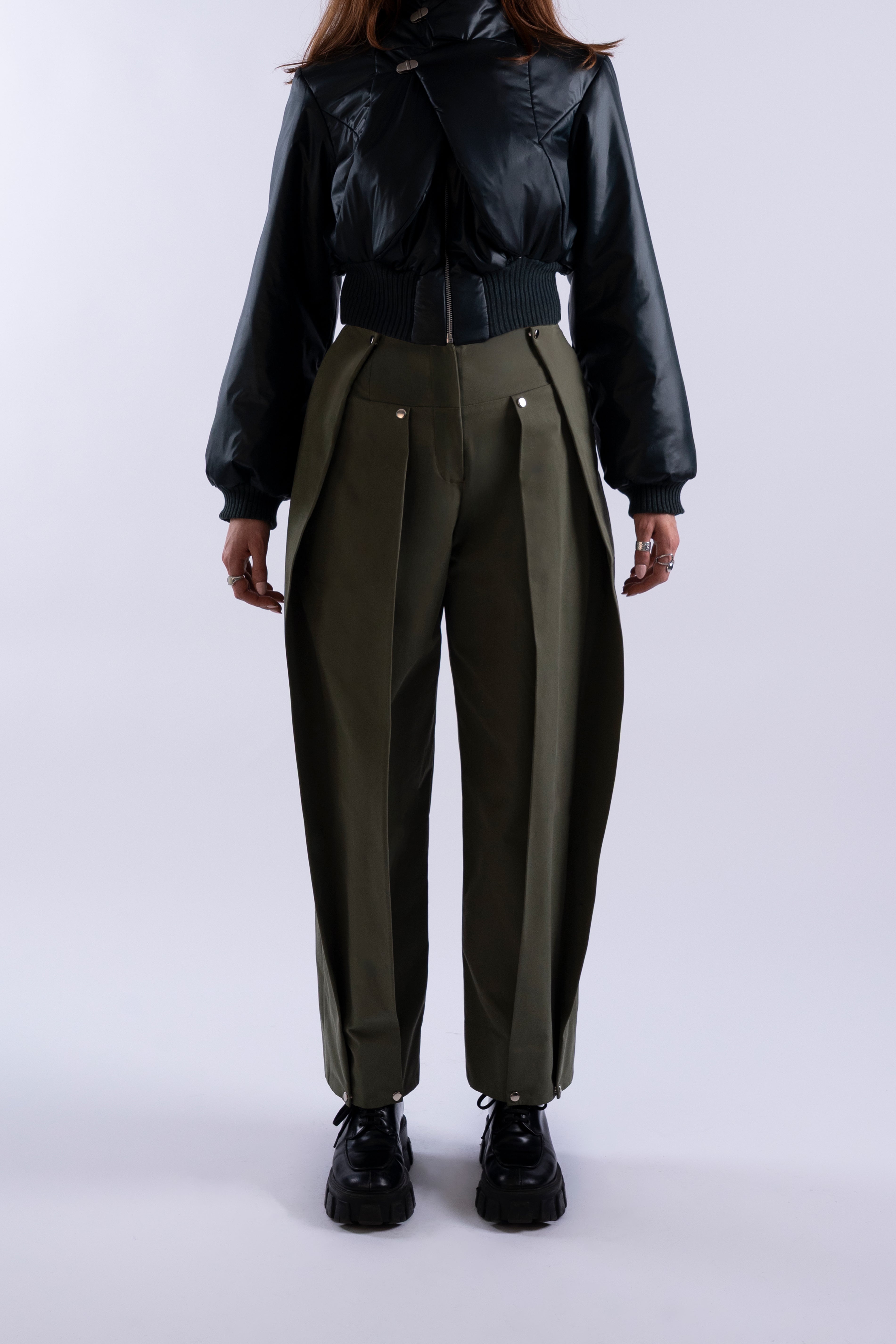 Front view of Stadion Double Pleat Trouser in fatigue green showing dual pleats and silver hardware.