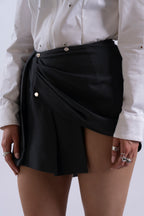 Side angle of Stadion InMotion Skirt highlighting polished metal snaps and drape.