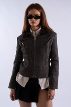 Angled front view showing structure, suede collar, and hardware of Lukret Coach Jacket.