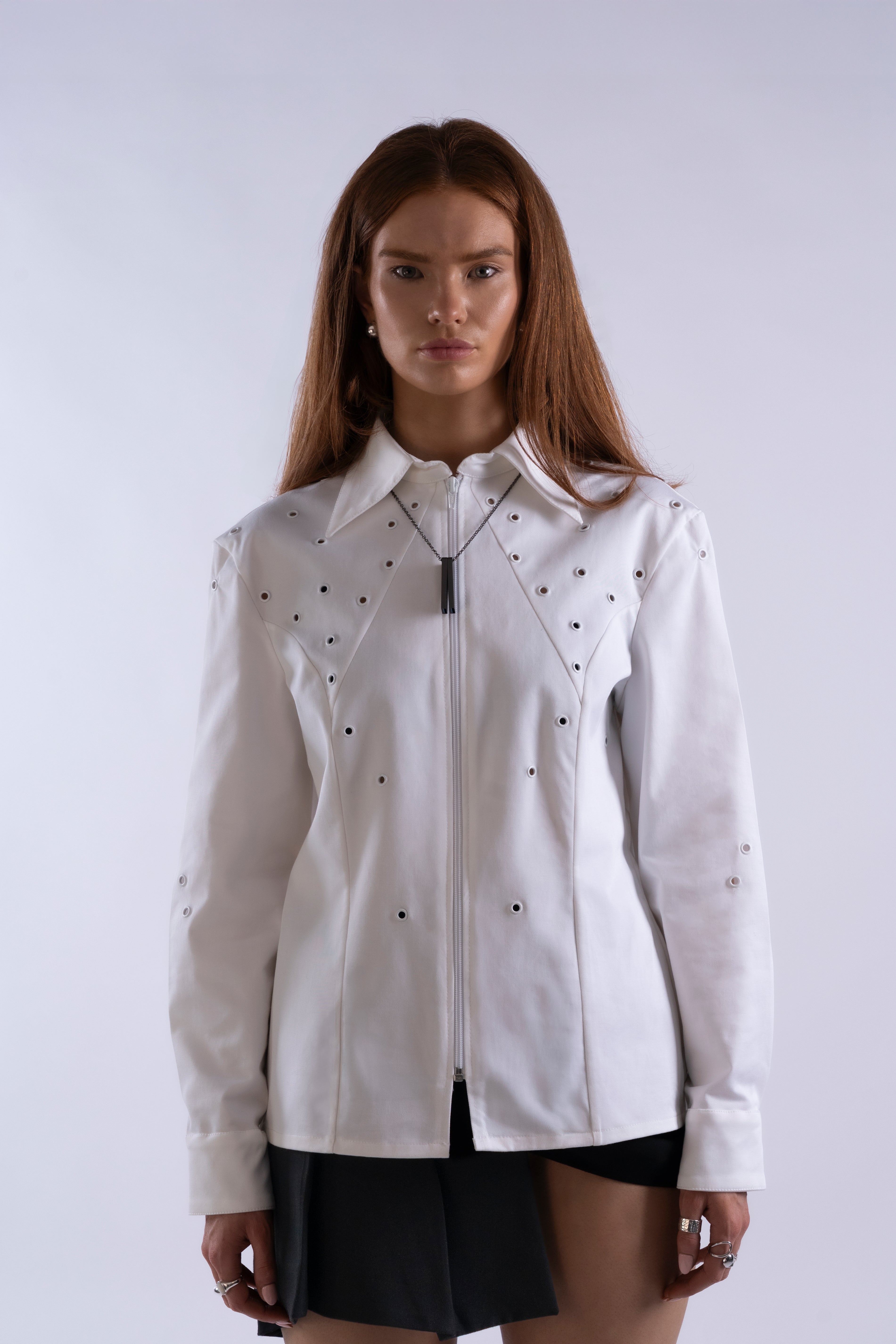 Model wearing Stadion Oculus Shirt, front view showing eyelet details and structured fit.