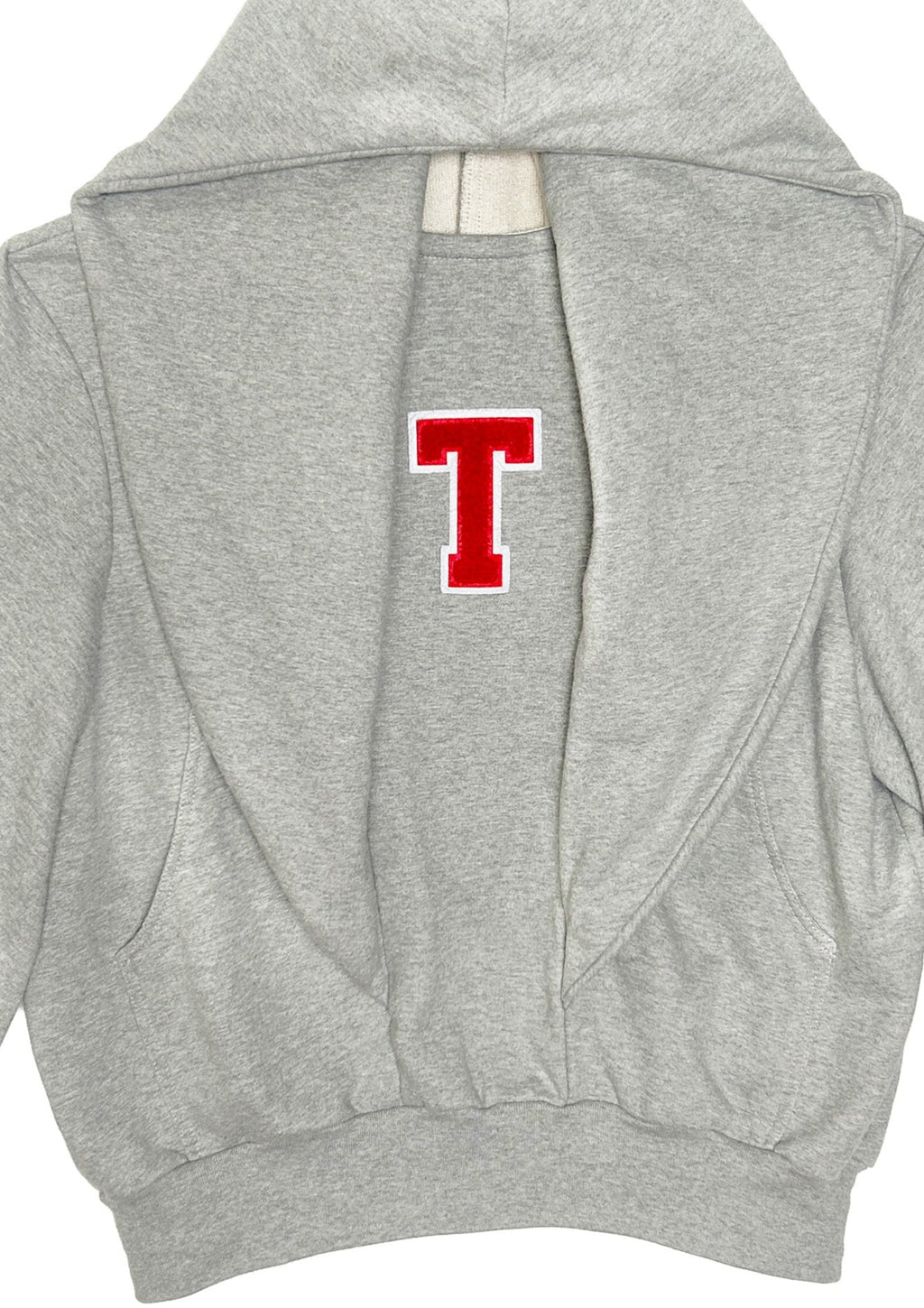 Close-up of grey STN Collegiate Hoodie by Stadion showing red T chenille patch and cotton loopback texture.